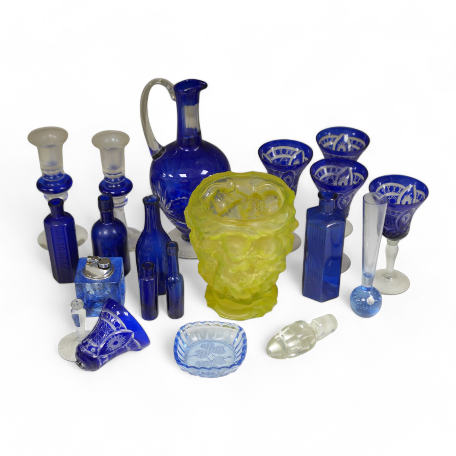 A yellow glass putti decorated vase, a blue glass decanter and other blue glassware, vase 18cm high. Condition. - one glass broken